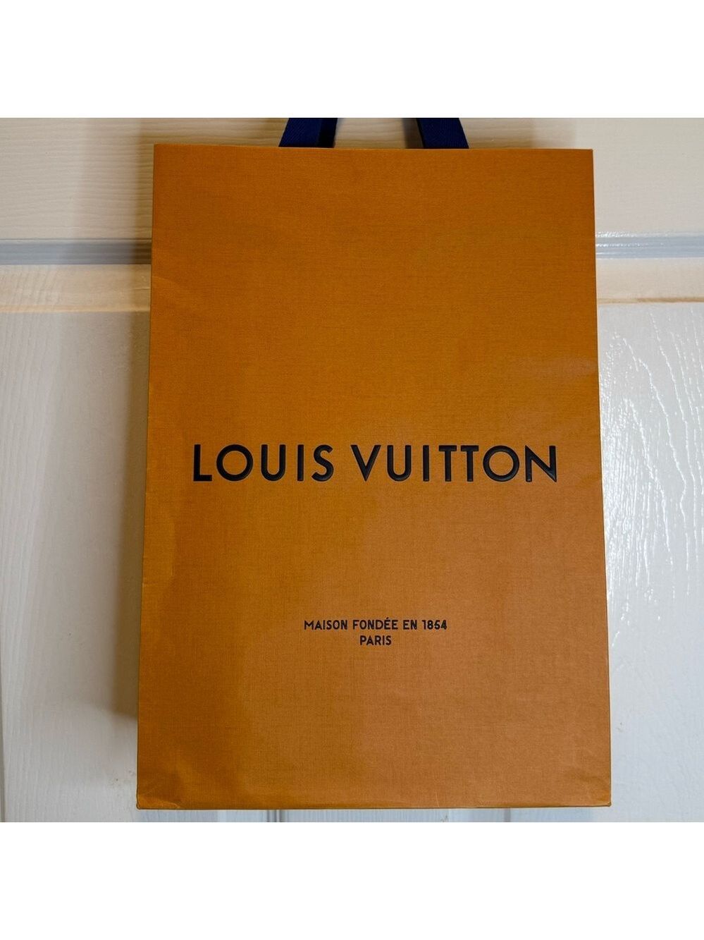 Louis Vuitton shopping bag 14” x 9.75” x 4.25”.